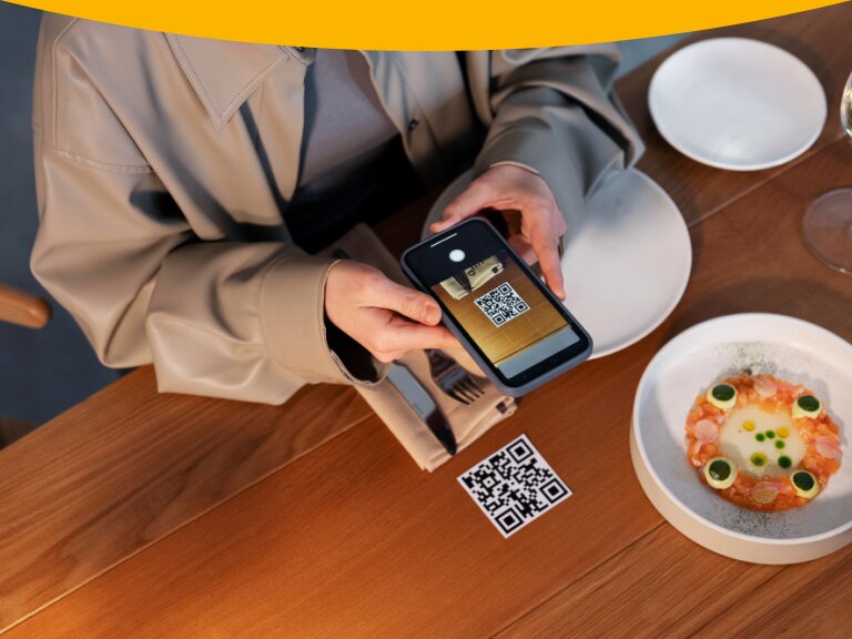 Customer scans QR code with mobile for Hubbo POS contactless ordering.